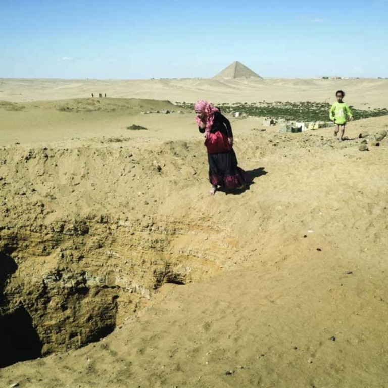 Man walks around he site of Cerro Quemado.